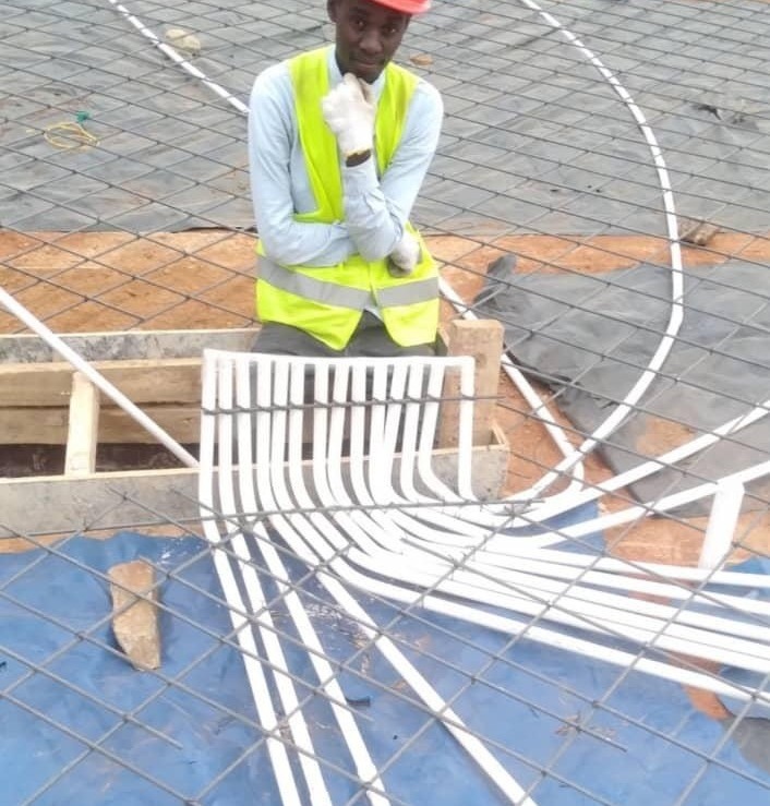 FlowTech technician installing electrical conduit on reinforced slab formwork